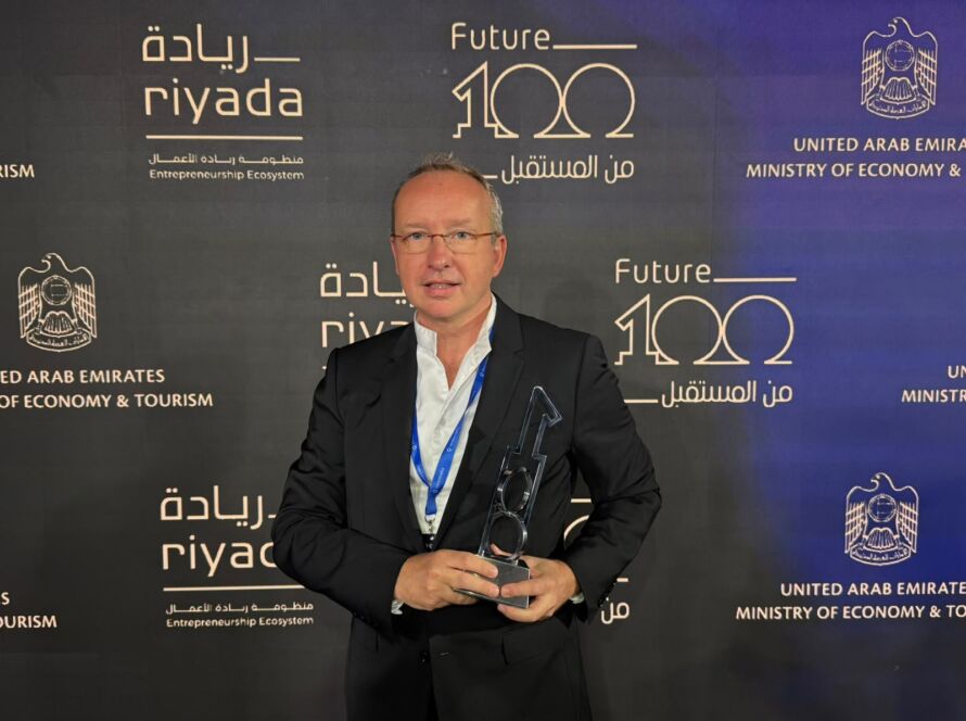 David Gravet, STHRIVE co-founder, holding the Future 100 trophy at the Abu Dhabi ceremony.